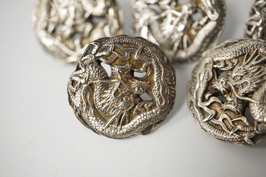 A set of 5 early 20th century Japanese white metal buttons decorated with dragons, 24mm. Condition - good